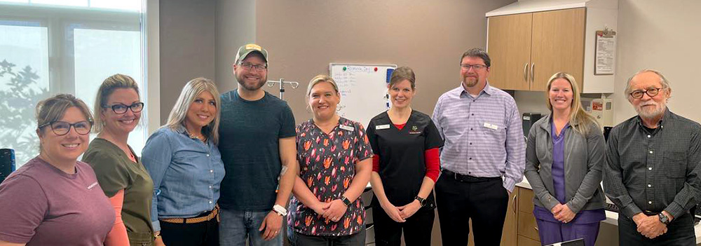 Patient celebrates his gene therapy treatment for hemophilia A with medical staff and family.