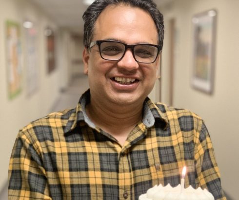 Dr. Kamal Abbi with cake